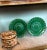 A pair of Wedgwood 19th century green glazed majolica sunflower plates from England.