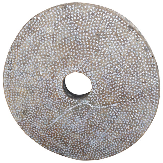 The top of an original rice pounder is repurposed into this impressive art piece. Handcut pieces of mother of pearl shell...