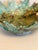 A striking hand-formed ceramic bowl inspired by layered leaves or unfolding petals, featuring dramatic sculptural edges...
