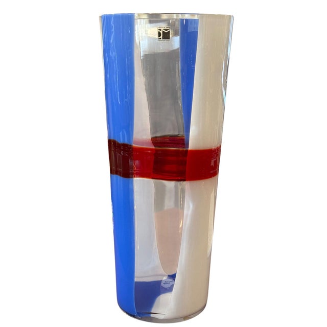 A striking hand-blown Murano glass vase by celebrated Italian glassmaker Carlo Moretti, dating to 2010. The tall, gently...