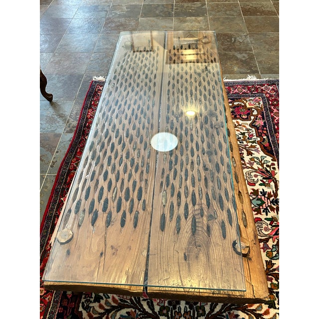 This threshing board was creatively converted to a coffee table. It’s rustic and ideal for a farmhouse interior. The...