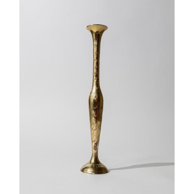 This vintage small brass vase from the 1960s is a charming decorative piece that showcases timeless craftsmanship and warm...