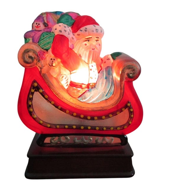 This limited-edition Santa in Sleigh light by Old World Christmas features hand-painted glass by artist EM Merck. A...