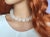 Genuine Swirl Carved Frosted Rock Crystal Beaded Necklace with Beautiful Mother of Pearl Toggle Clasp The length of the...