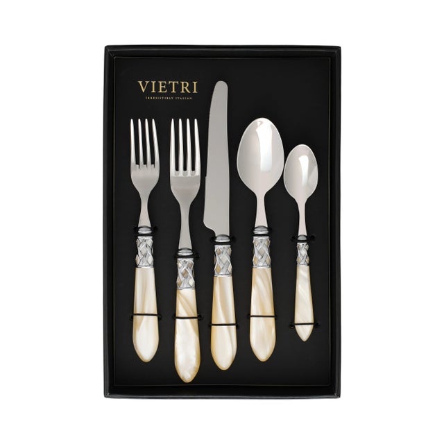 The Aladdin Brilliant Flatware Five-Piece Place Setting - service for one guest - features elegant pearlized handles with...