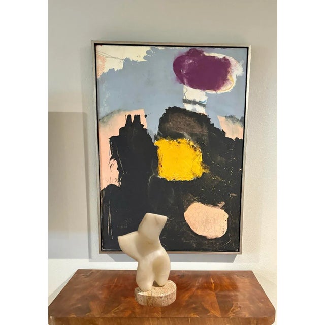 California artist Frank Lauren hand carved this abstract torso out of alabaster and mounted it to a marble base. It is not...