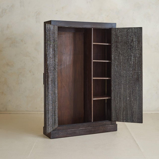 A French cabinet from the 1940s, sourced from an estate that included a number of pieces attributed to Jacques Quinet, and...