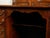 An English Georgian period mahogany desk from the 19th century, with 10 graduating drawers and brass hardware. Created in...