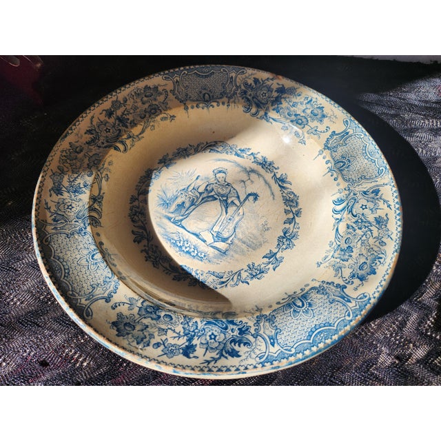 This is a striking, slightly rustic, antique French hollow plate from Terre de Fer de Grigny, produced around the 1850s....