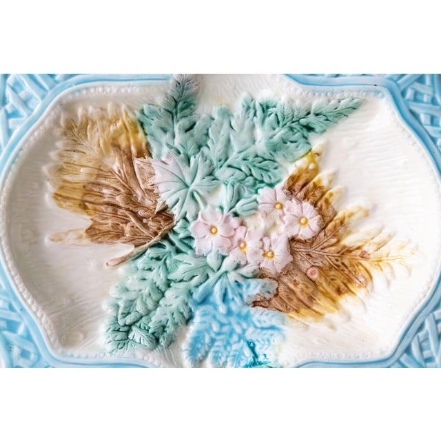 A lovely antique 19th Century English majolica platter with leaves, flowers, and a basketweave border in gorgeous...