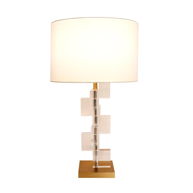 Drawing from Art Deco design, this retro influenced table lamp composed of crystal is a modern masterpiece. The geometric...