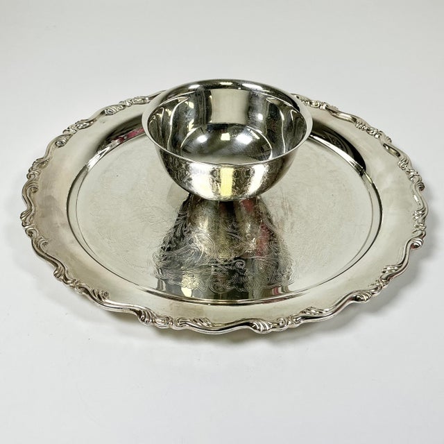 A great addition to your Silverplate serve ware collection. This round traditional Baroque style serving tray has an...