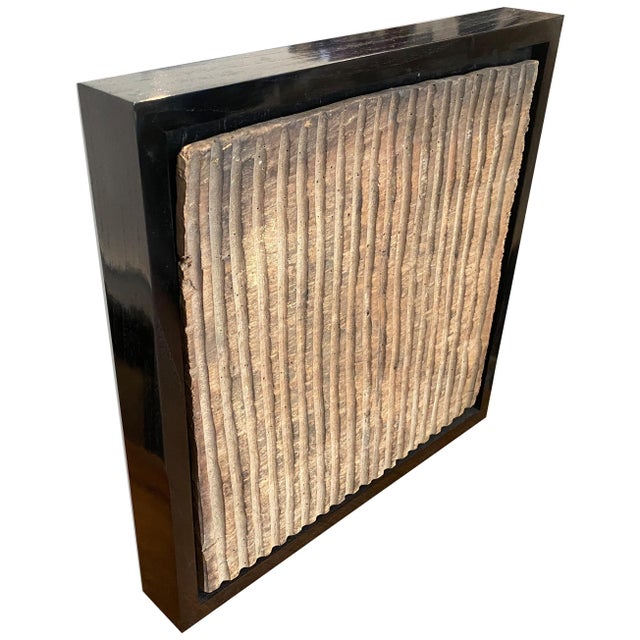 Antique hand carved panel from Toraja. Framed in a Minimalist black teak wood shadow box. This carving symbolizes the...