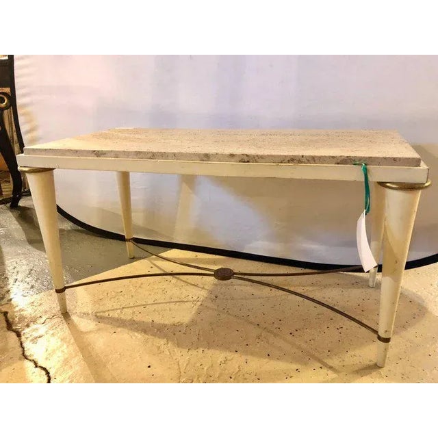 Mid-Century Modern coffee table with inset travertine marble top, giltwood and brass X form stretcher, circa 1960.