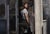 Contemporary Exit by Stefan Smit | Oil on loose canvas Woman exiting a building through a door. For Sale - Image 3 of 4