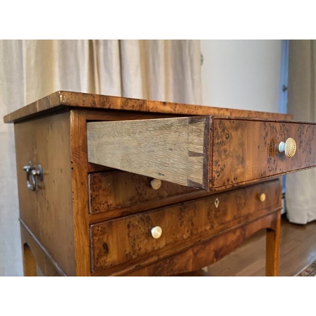 A vintage Biedermeier style richly figured, warm honey-toned veneered burl wood small rectangular side table with three...