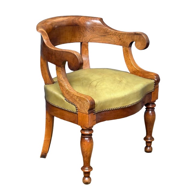 A fine French desk chair (fauteuil de bureau) from 19th century, featuring a frame crafted from walnut displaying the...