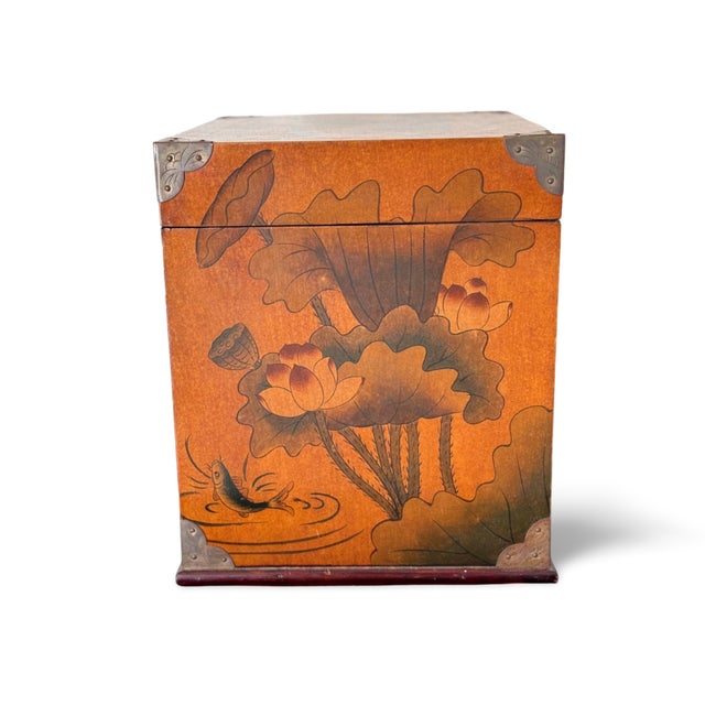 This striking vintage Asian lacquered scholar’s chest is a beautifully detailed storage piece that blends artistry with...