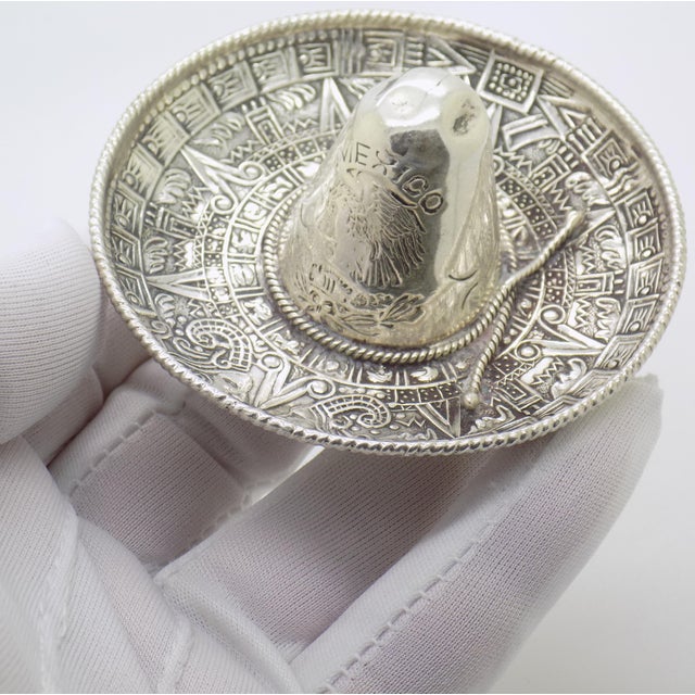 A solid silver traditional Mexican hat figurine, sourced in Italy and dating to the 1970s to 1980s. This piece is inspired...