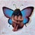 Solace Fairy by Matteo Di Ventra | Oil on Panel of a girl with butterfly wings sitting down For Sale