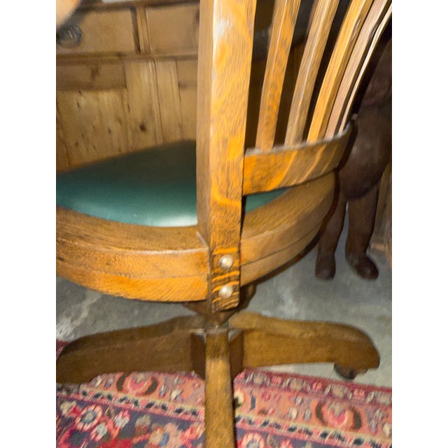 Antique oak bankers chair. On wheels it is adjustable up three different heights. Great solid craftsmanship. In good...