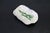 A studio made ceramic catch all, tray featuring a free form abstract green glazed center on a blanket free form body of...