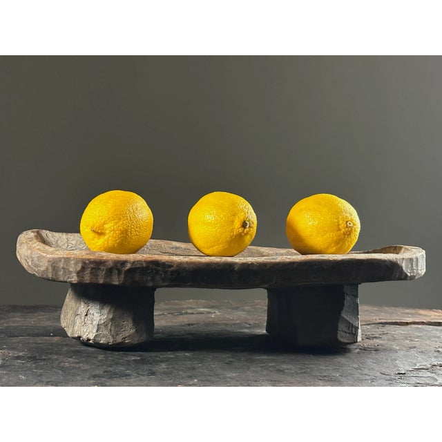 Antique Folk Art Hand Carved Footed Wood Tray. Carved from a single piece of wood. In used condition with cracks and wear...