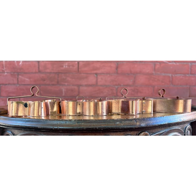 This is a gorgeous set of four vintage solid-copper cookie cutters featuring heart, star, maple leaf, and four-leaf clover...