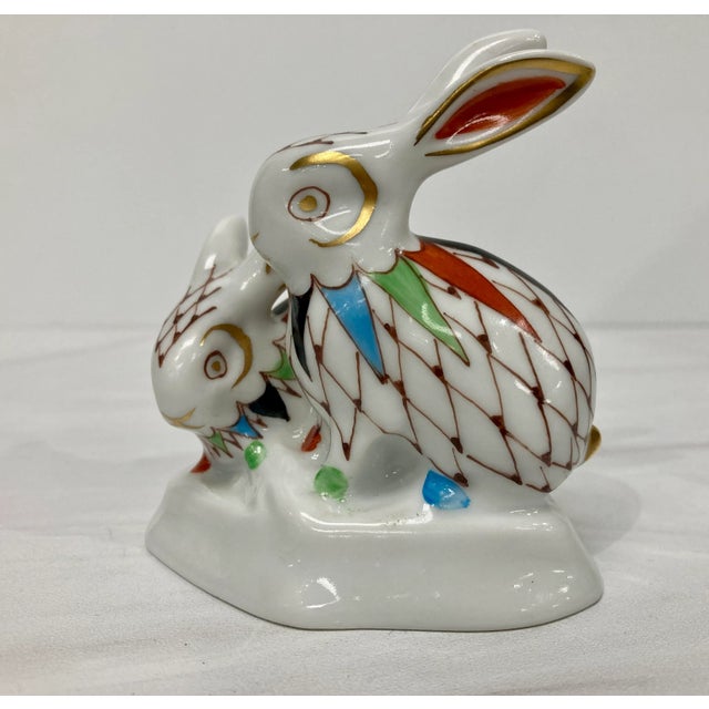 Charming pair of handpainted porcelain 'snuggle' bunnies from Hollohaza in Hungary in the fishnet pattern. Delightful...