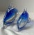 Hand-blown Murano-style art glass dolphin sculptures in graduated sizes, featuring a luminous cobalt blue sommerso core...