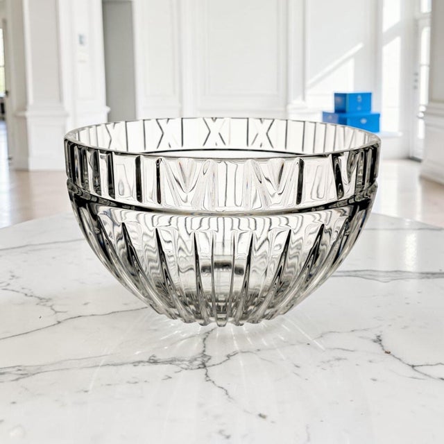 A substantial crystal centerpiece bowl attributed to Tiffany & Co., designed in the distinctive Atlas pattern and dating...