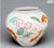 This striking porcelain piece, titled The Vase of the Golden Carp, was designed by artist Zhe Zhou Jiang and issued by The...