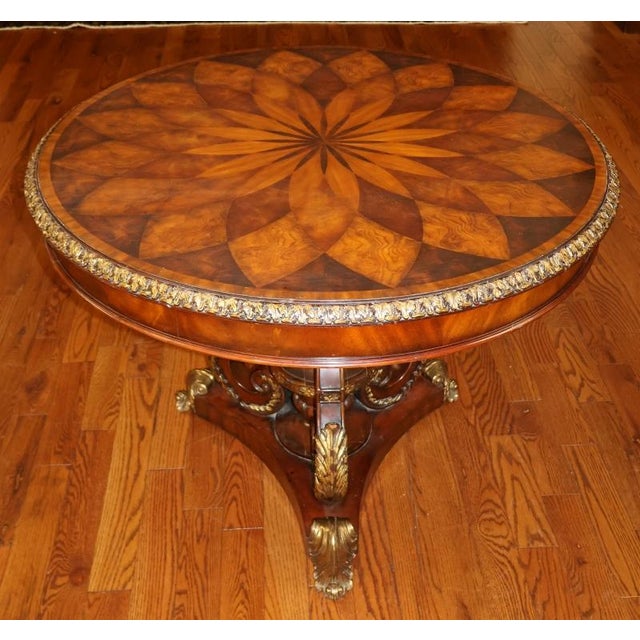 Maitland Smith Spiro Mixed Wood and Metal Entry Center Table Dimensions : 40" Wide X 40" Deep X 30" Tall This table was...