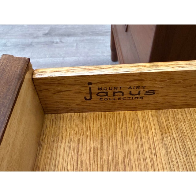 Beautiful pair of mid century modern walnut nightstands manufactured by Mount Airy Janus Collection, professionally restored.