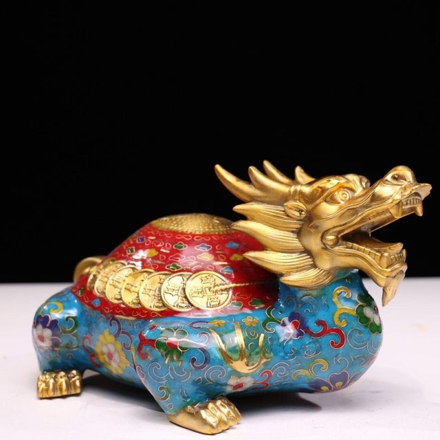 This striking sculpture depicts a dragon-turtle (Longgui), a traditional symbol of longevity, stability, and wealth. The...