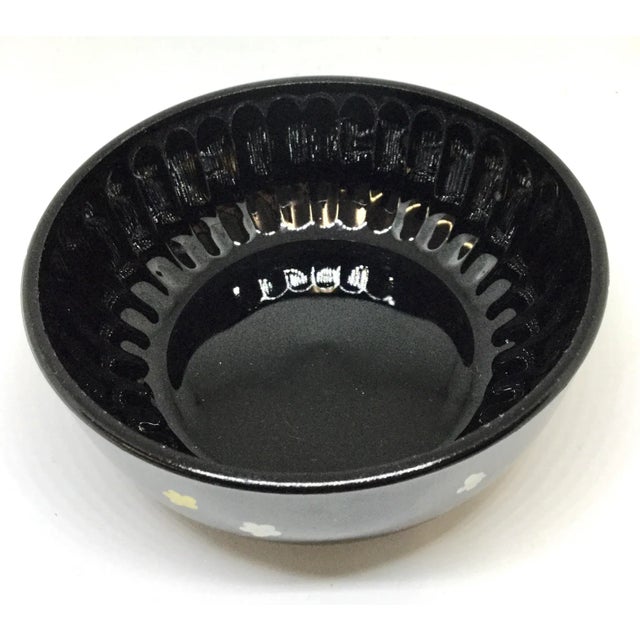 Unique little dish for multiple uses. Be it a trinket dish, a soap dish or a candle holder. Deep black glass has been...