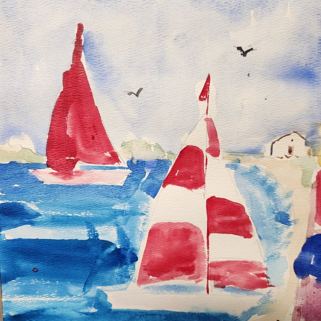 An elegant and spirited coastal watercolor, this original work by artist Donna captures the dynamic movement of sailboats...