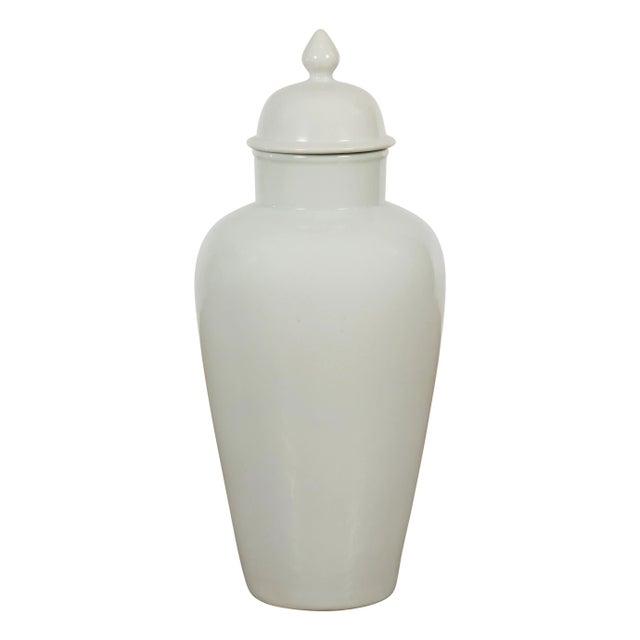 A large Chinese vintage blanc de Chine porcelain altar vase from the mid 20th century, with subtle grey tone and lid....