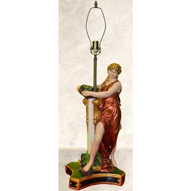 This exquisite Mid-Century chalkware table lamp is a masterful blend of artistry and elegance, showcasing a neoclassical...
