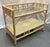 Versatile vintage Ficks Reed style rolling bar cart from the late 20th century. It's made of rattan in a driftwood color...