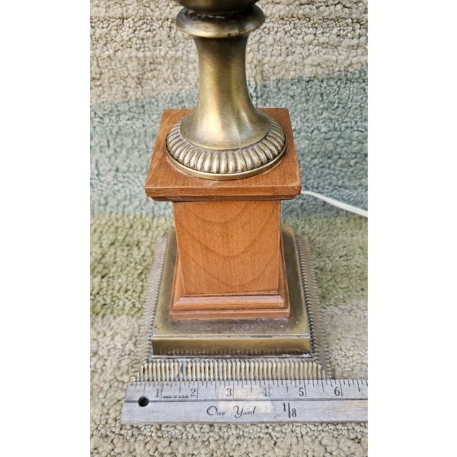 Elegant Rembrandt table lamp showcasing classic Mid-Century Modern design with a sophisticated blend of warm wood and...