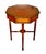 Mahogany solids coupled with crossbanded Roswood inlays accented by satinwood make this center table a striking piece....