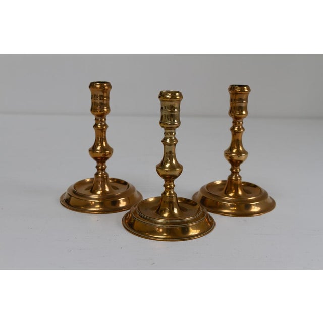 Antique Danish "Næstved" Brass Candlesticks. Set of 3. Set of three baroque candle holders in solid brass from Næstved in...