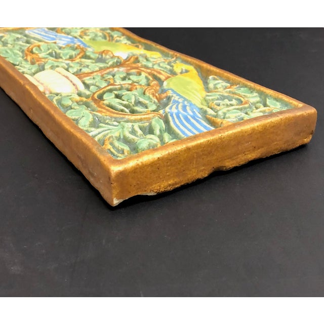 Calco (California Clay Products), South Gate, CA 1923-1932 Stunning vintage relief tile depicts opposing peacocks perched...