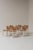 A rare set of seven Baba dining chairs designed by Assostudio for Pozzi & Verga in the 1980s. Characterized by their...