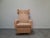 An authentic Mid-Century Modern wingback lounge armchair produced in Czechoslovakia during the 1960s. The chair features a...