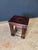 Set of three Antique leather top nesting tables. Each table has a different native design hand tooled into the top. The...