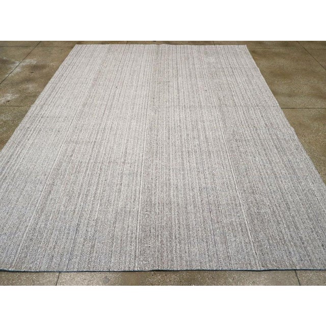 A vintage Turkish flatweave Kilim room size carpet handmade during the mid-20th century. Measures: 9' 2" x 12' 0".
