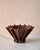 Designed as both a functional bowl and a statement art object for modern interiors, this gorgeous, sculptural stoneware...
