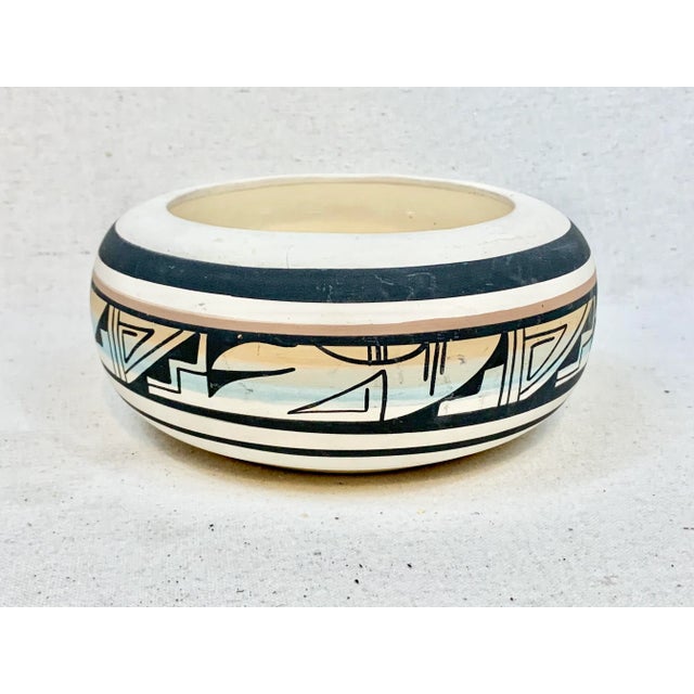 Wonderful vintage decorative bowl. Signed on the bottom. Beautiful geometric design and soft colors with a bold line. The...